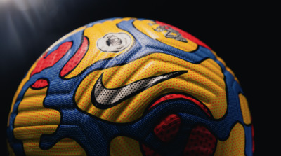 a close up of a soccer ball on a black background