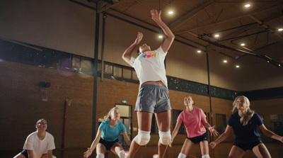 a group of people playing a game of basketball