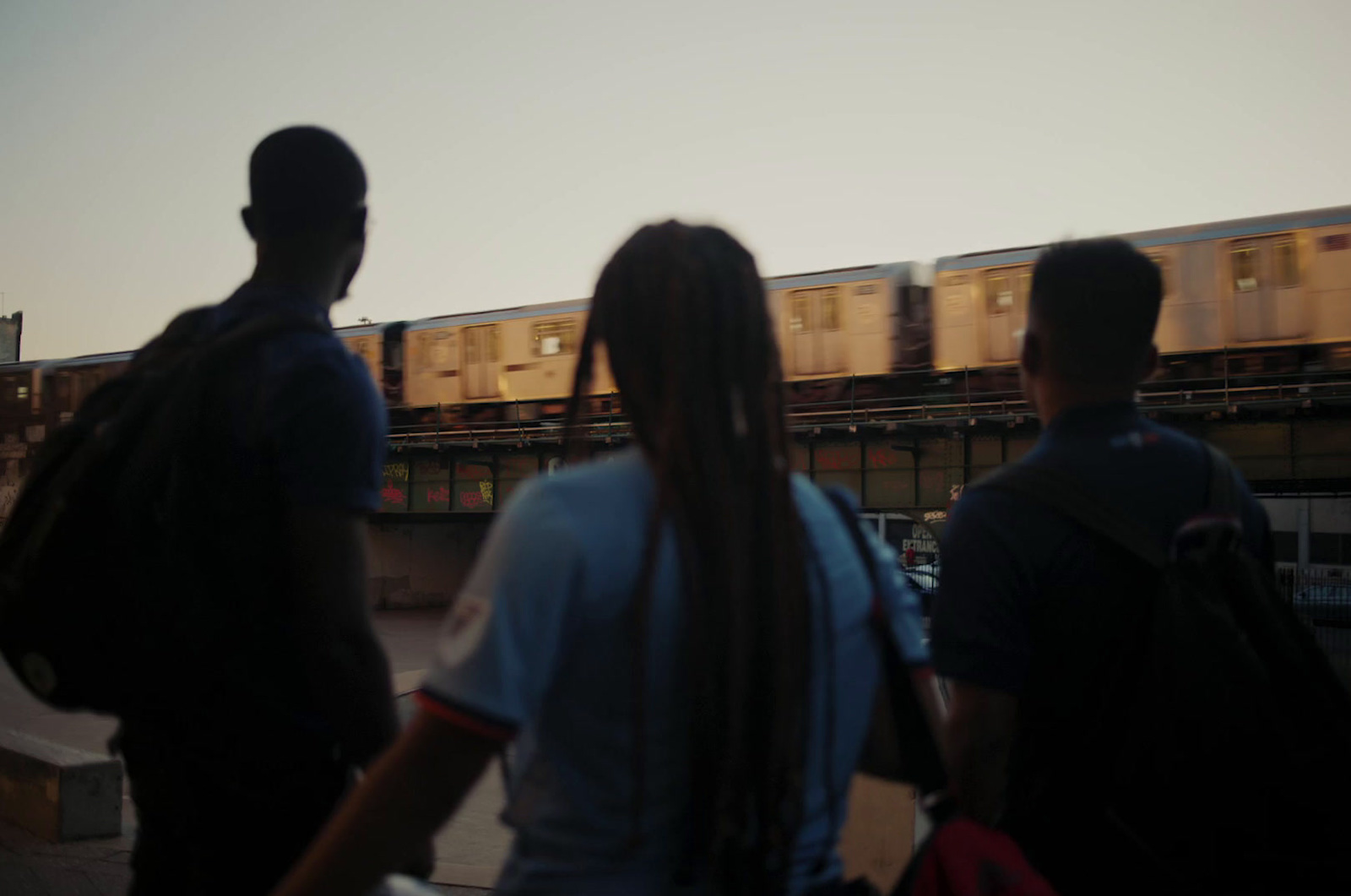 a group of people standing next to each other near a train