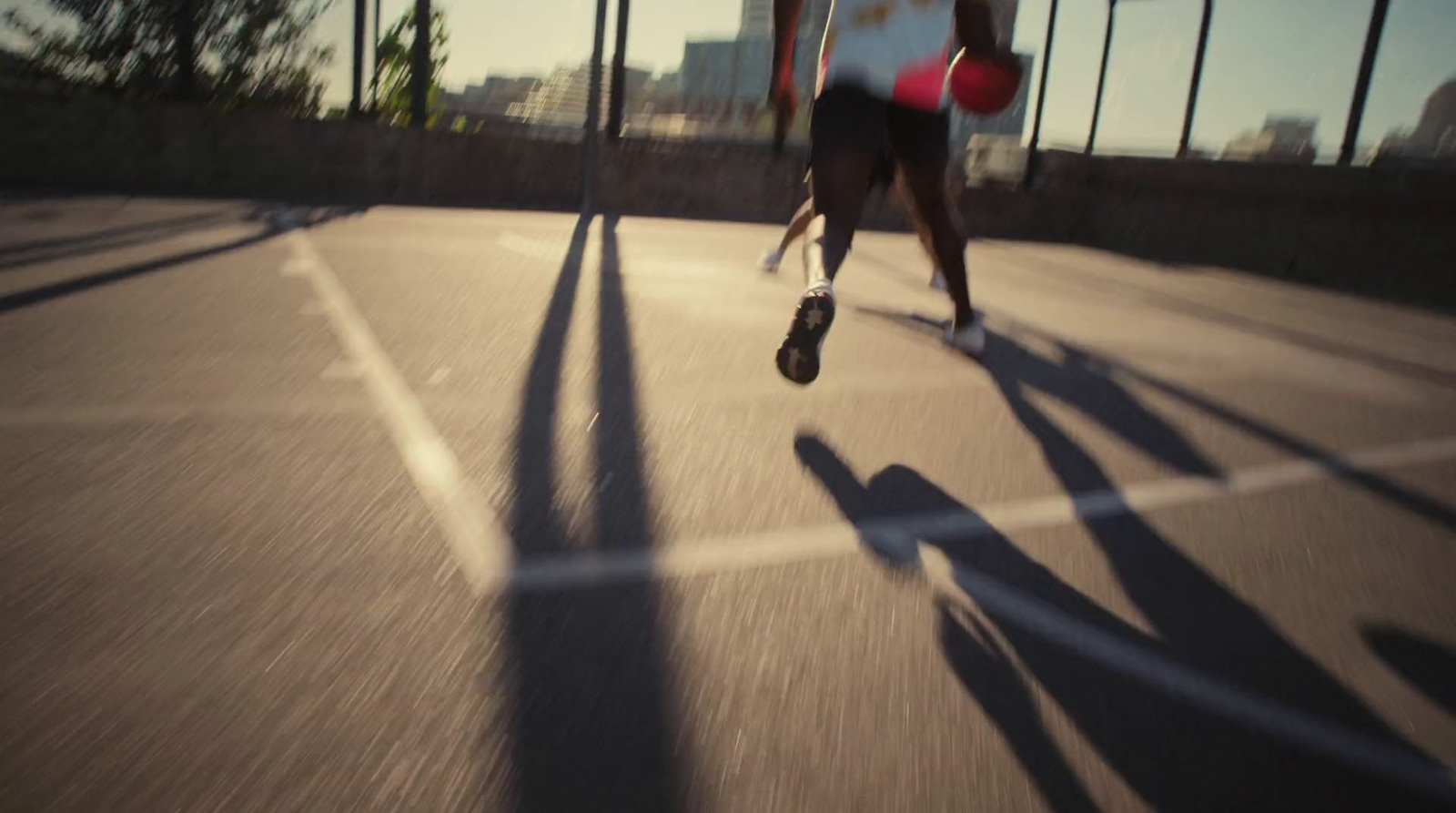 a man is running with a frisbee in his hand