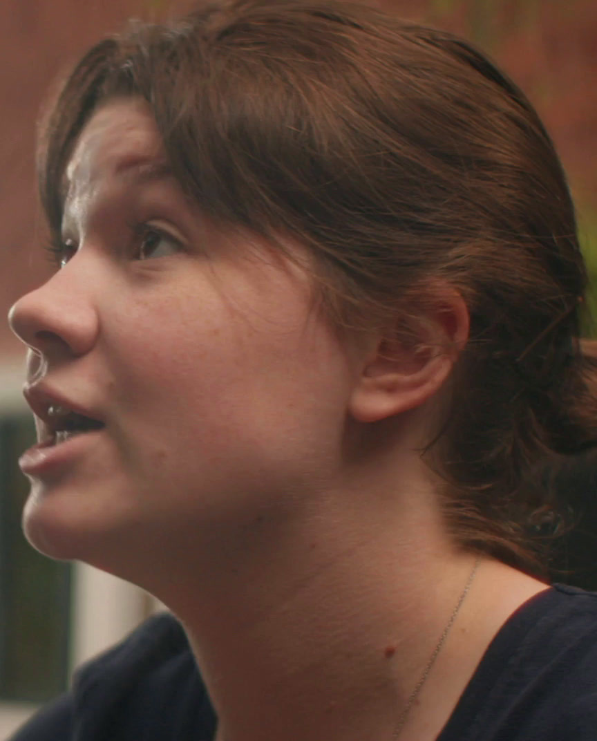 a close up of a person talking on a cell phone