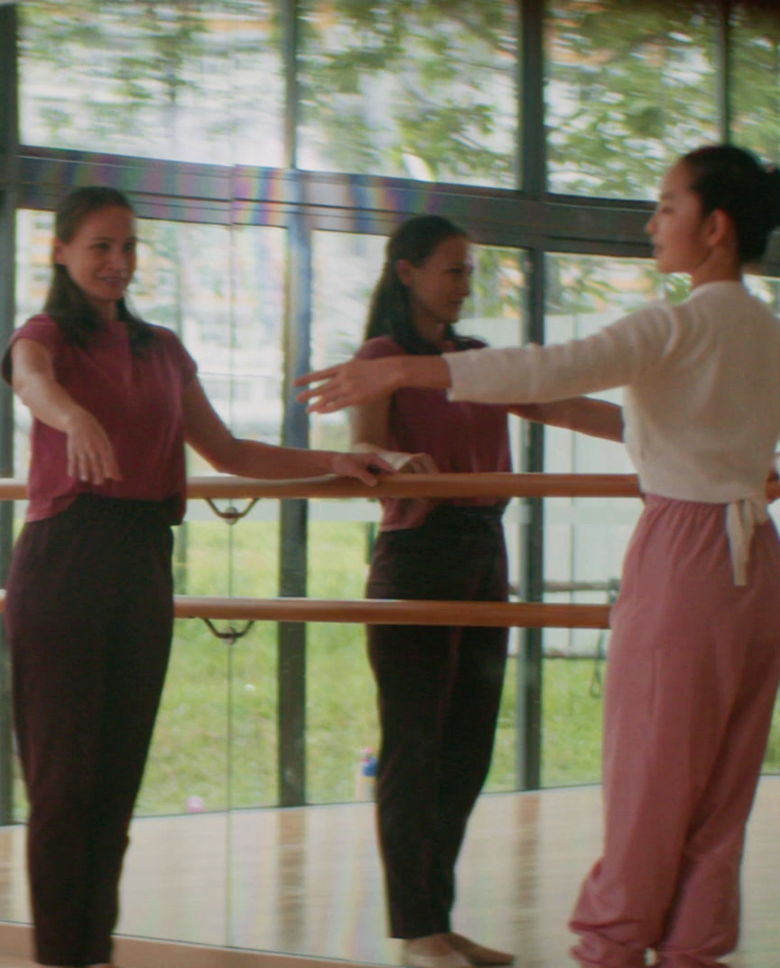 a group of young women standing next to each other