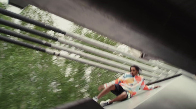 a man riding a skateboard down a metal rail