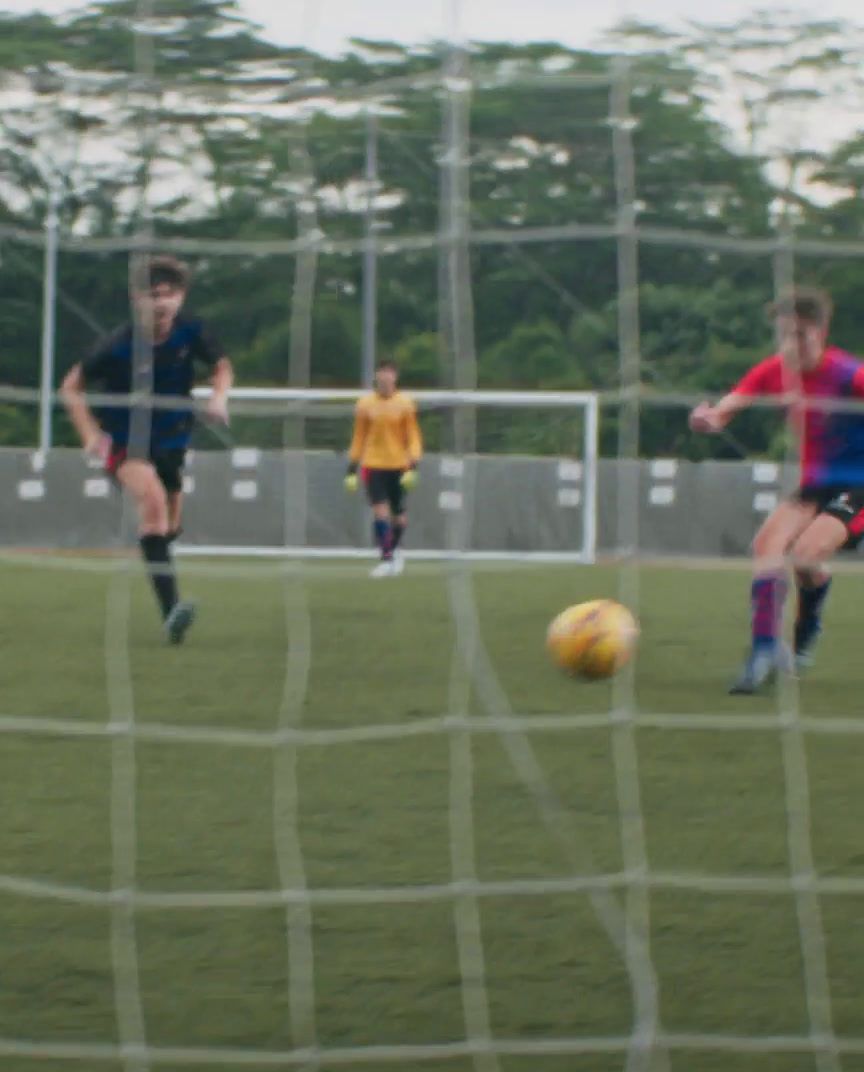 a group of young men playing a game of soccer