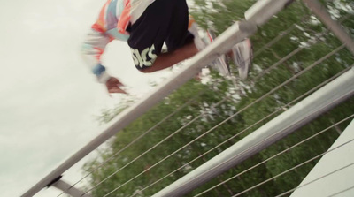 a man riding a skateboard down a metal rail