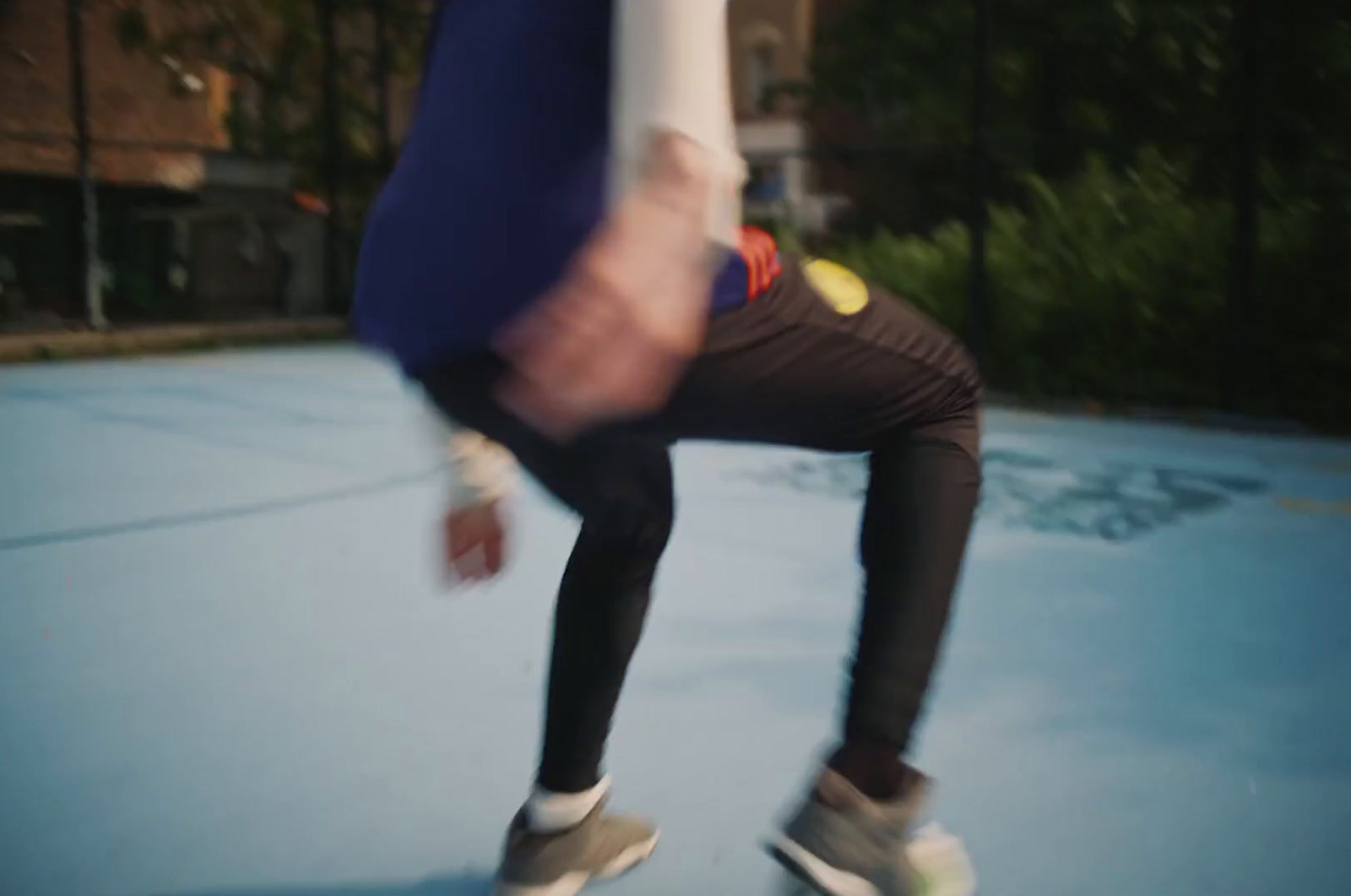 a person riding a skateboard on a blue surface