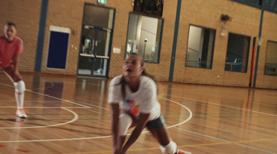 a group of young people playing a game of frisbee