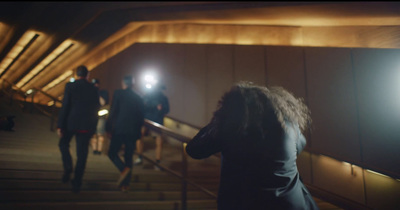 a group of people walking down a flight of stairs