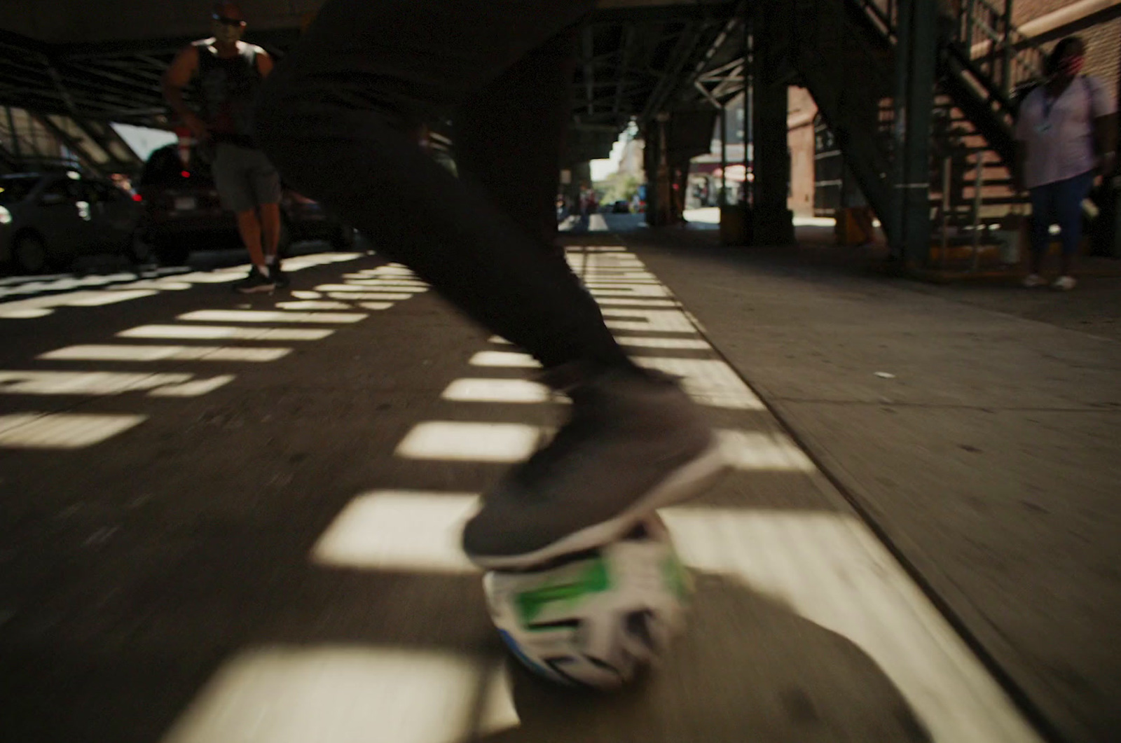 a person riding a skateboard down a street