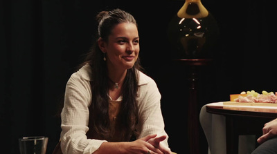 a woman sitting next to a man at a table