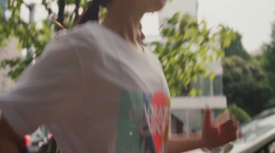 a woman in a white shirt is holding a frisbee