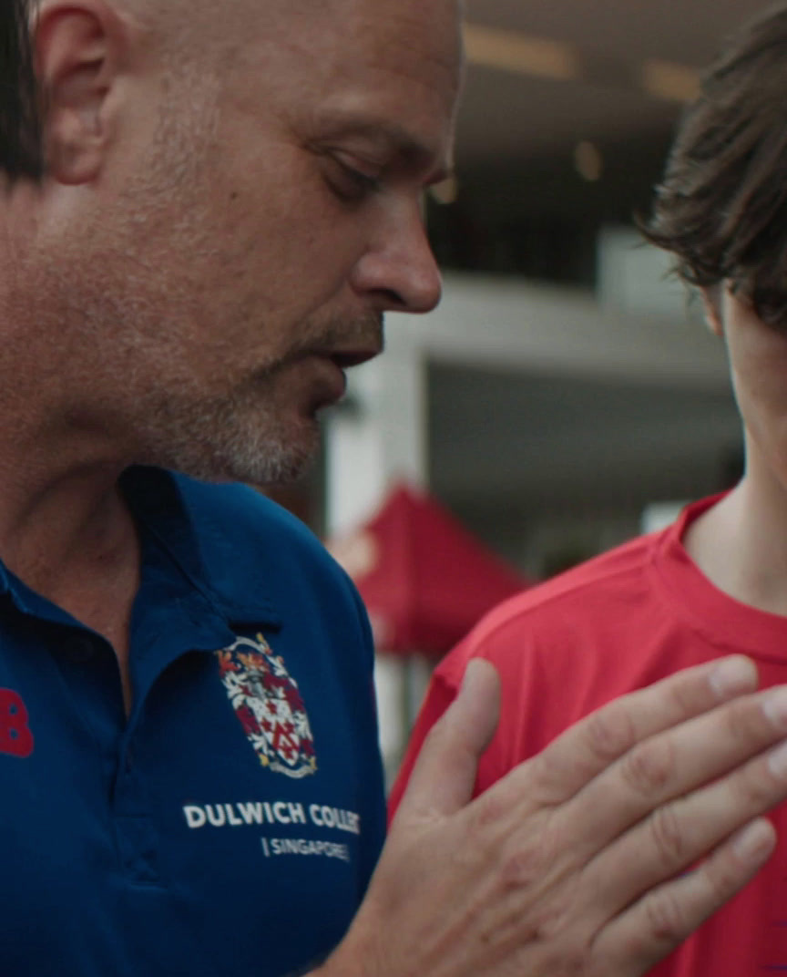 a man in a red shirt and a man in a blue shirt