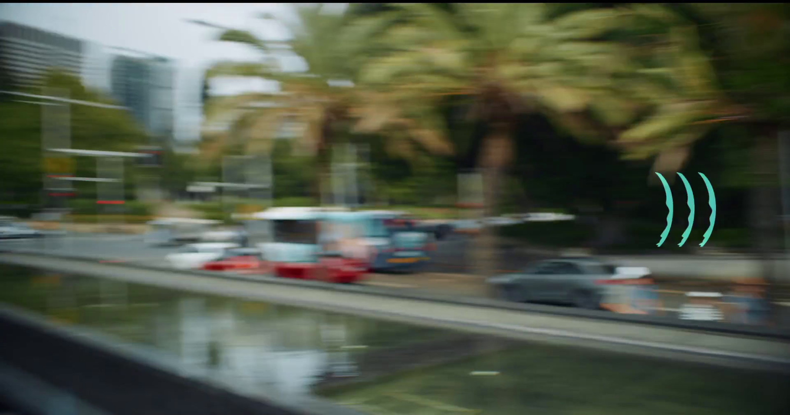 a blurry photo of a city street with palm trees