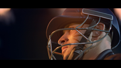 a close up of a baseball player wearing a helmet