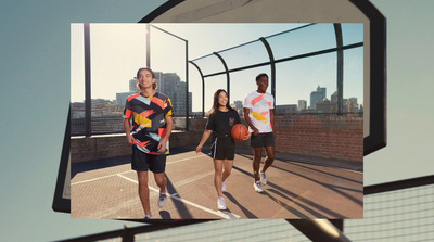 a group of people walking across a tennis court