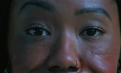 a close up of a person with a nose ring