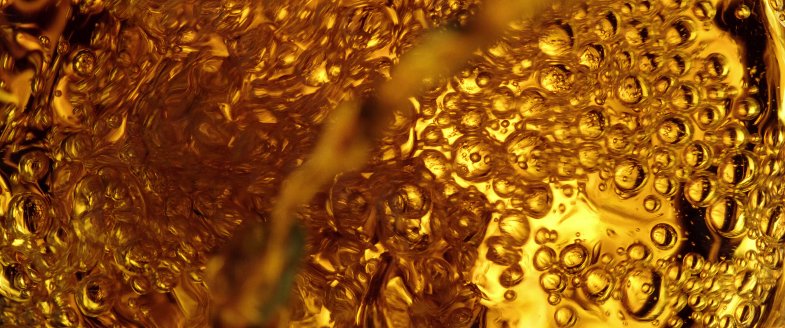 a close up of a glass with water droplets