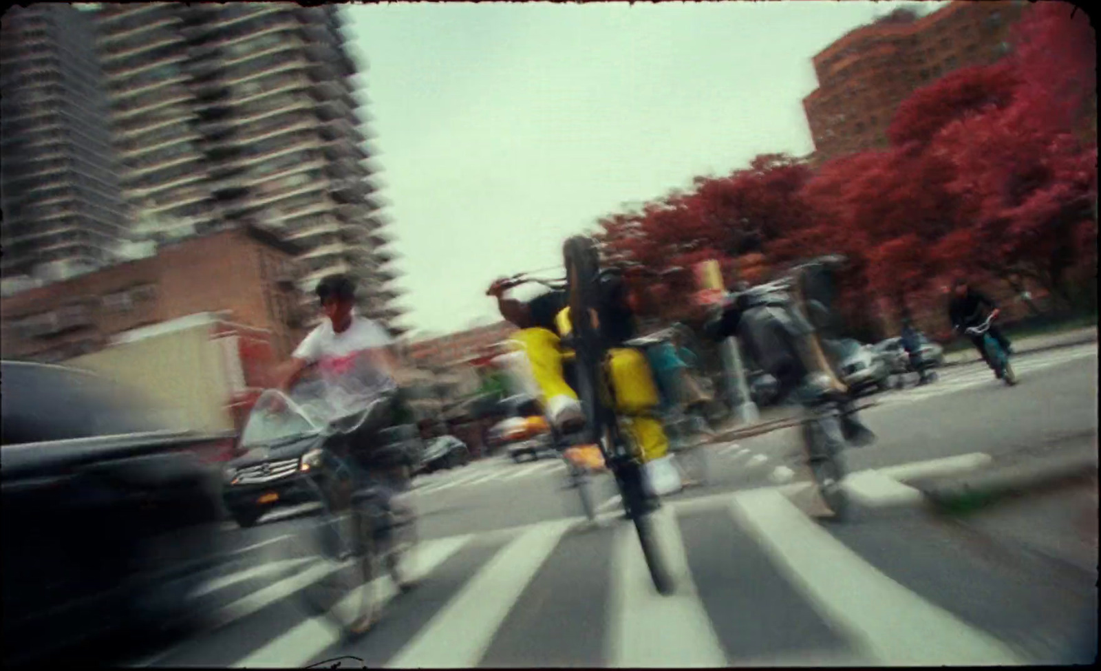 a blurry photo of people crossing a street