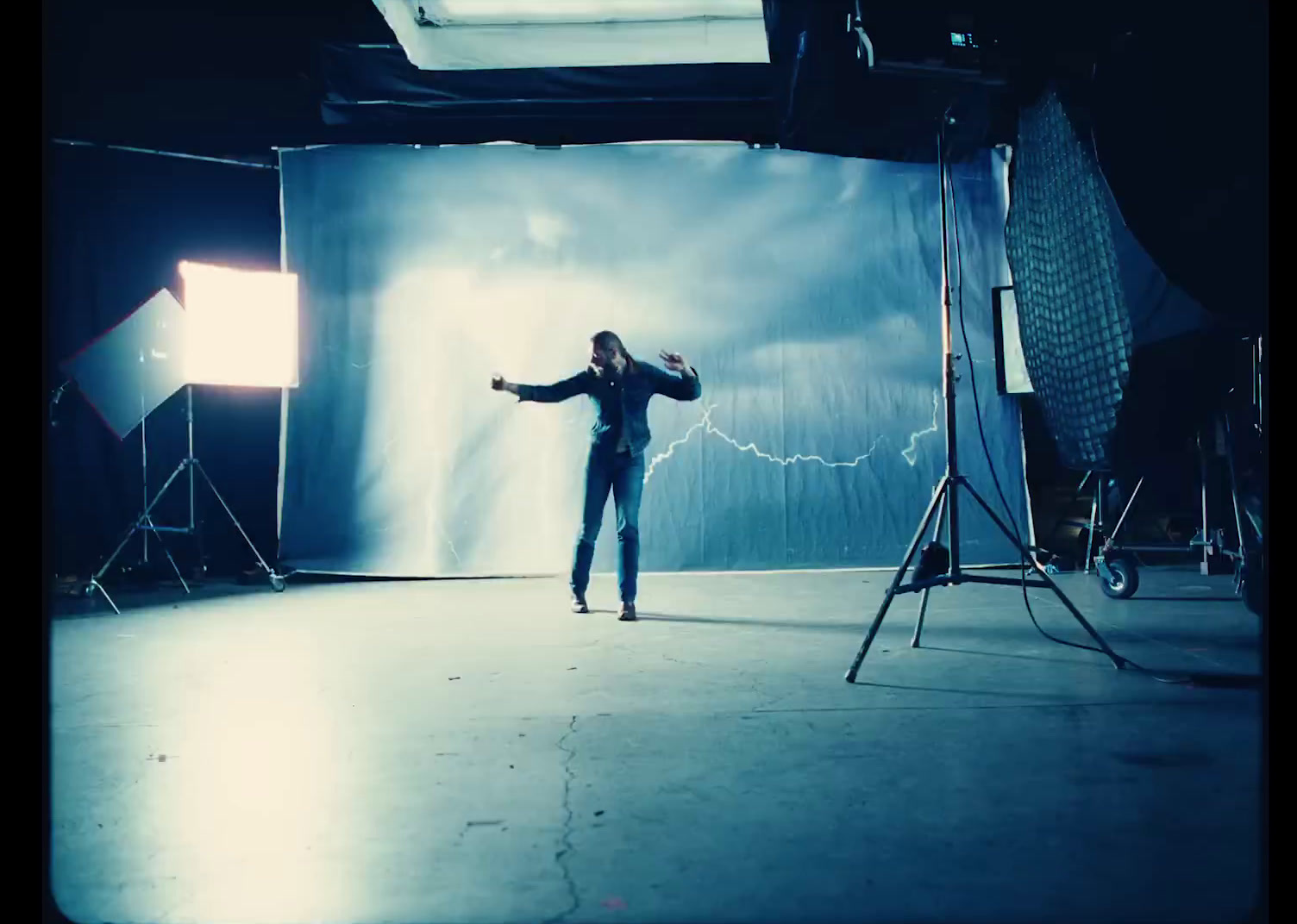 a man standing in front of a camera in a room