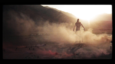 a man standing on top of a ladder surrounded by smoke