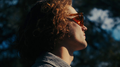 a close up of a person wearing sunglasses