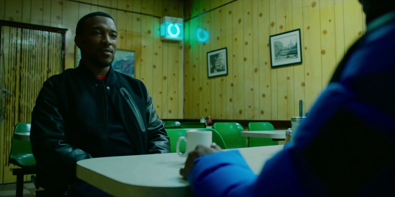 a man sitting at a table in a restaurant