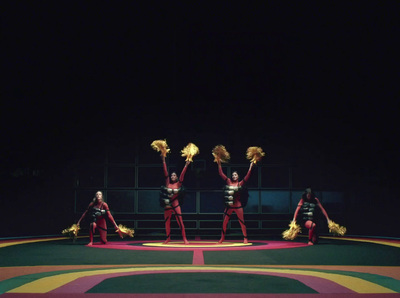 a group of people standing on top of a colorful floor