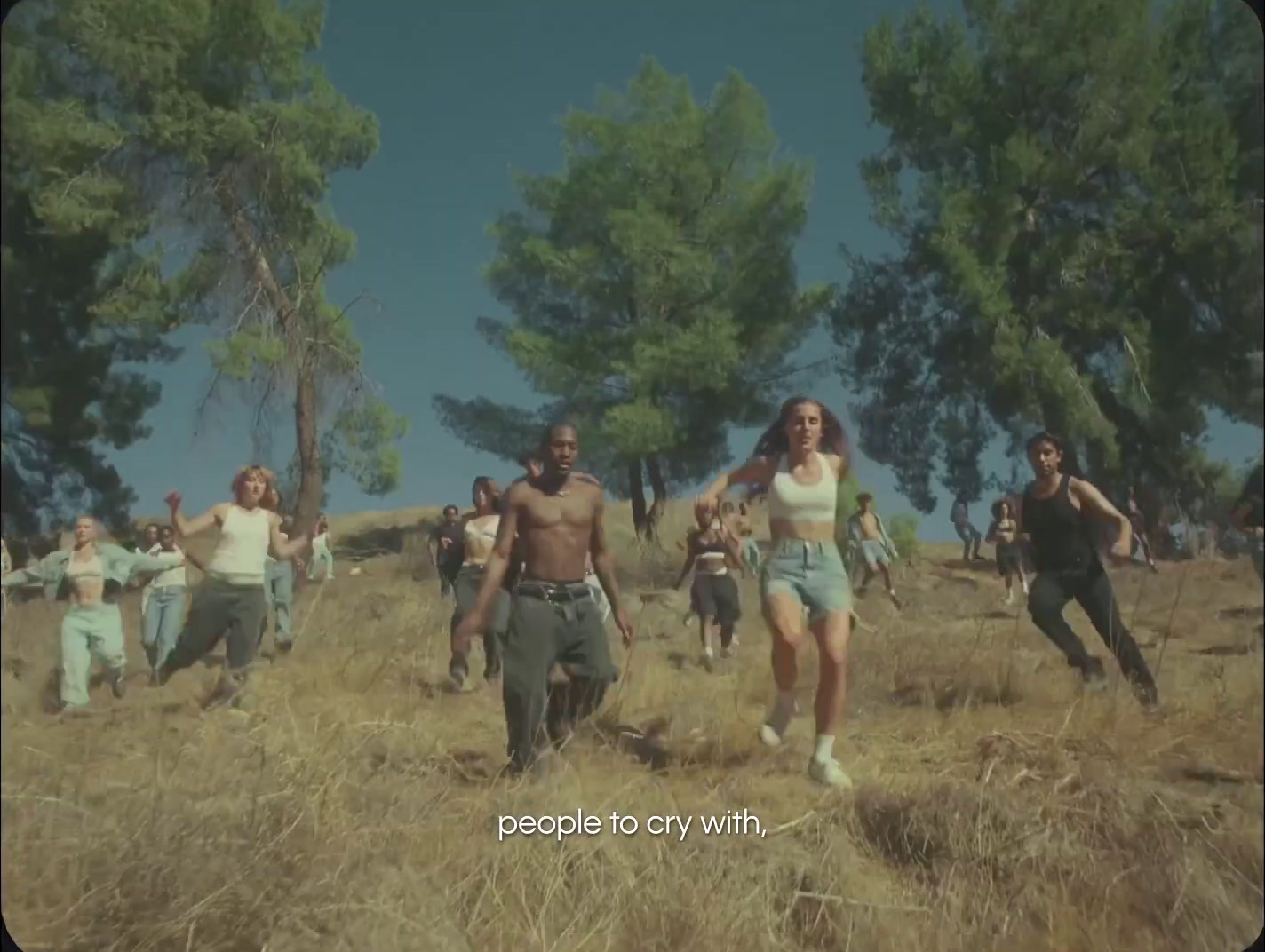 a group of people running through a field