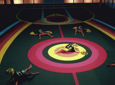 a group of people laying on top of a colorful floor