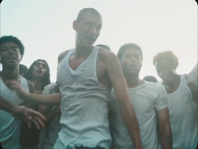 a group of young men standing next to each other