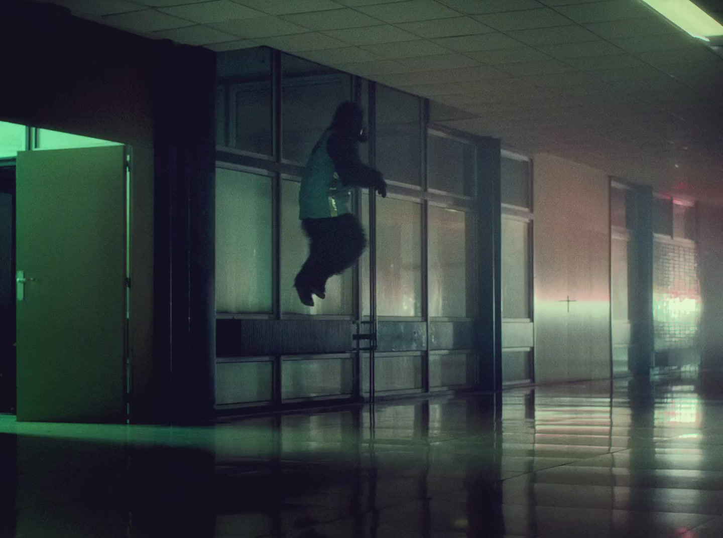 a person jumping up into the air in a building