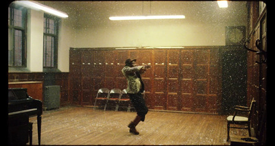 a person standing in a room with a piano