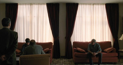 a group of people sitting around a living room