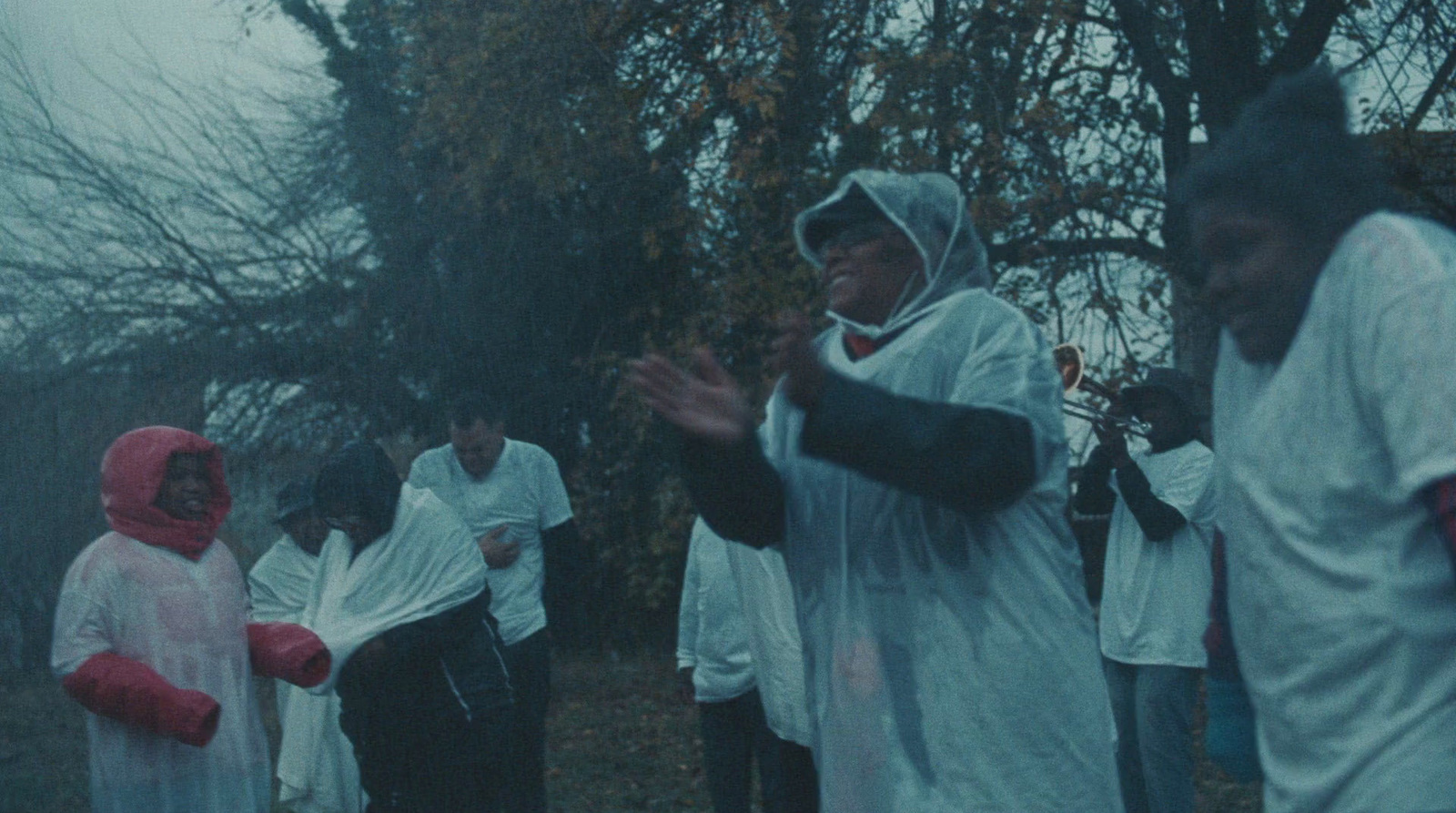 a group of people standing around each other