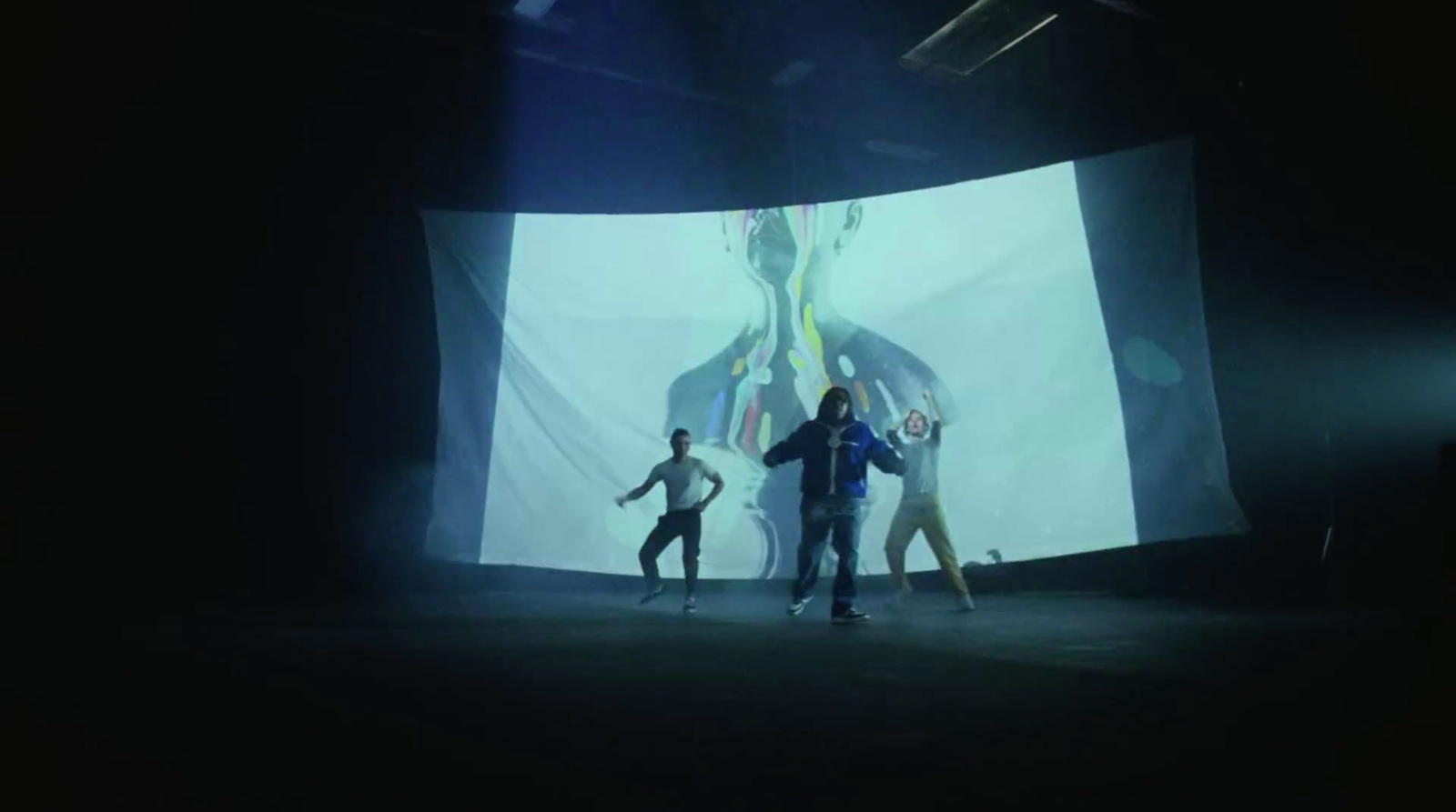 a group of people standing on top of a stage