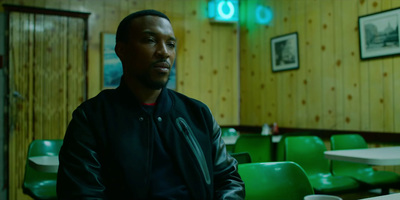 a man sitting at a table in a restaurant