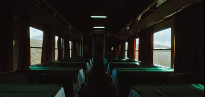 a train car filled with lots of tables and chairs