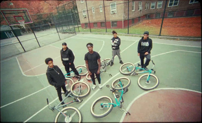 a group of young men standing next to each other on a basketball court