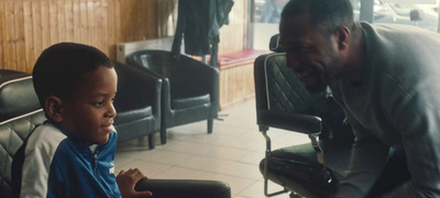 a man and a young boy sitting in chairs