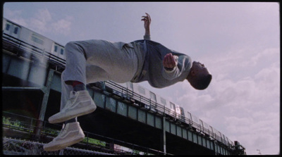 a man flying through the air while riding a skateboard