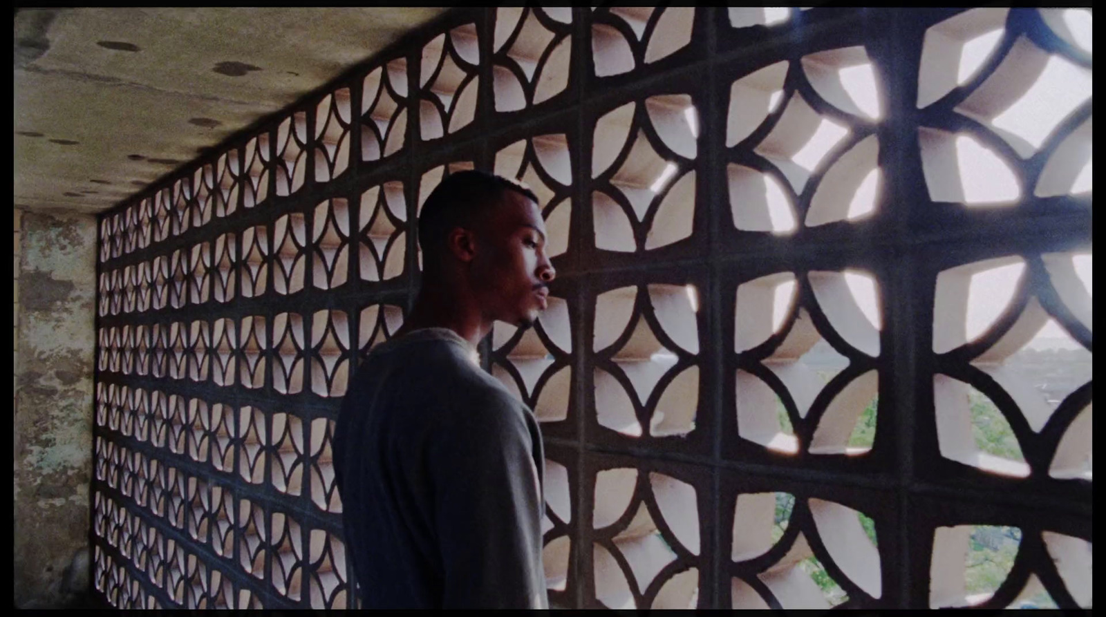 a man is standing in front of a wall