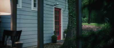 a house with a red door and a red window