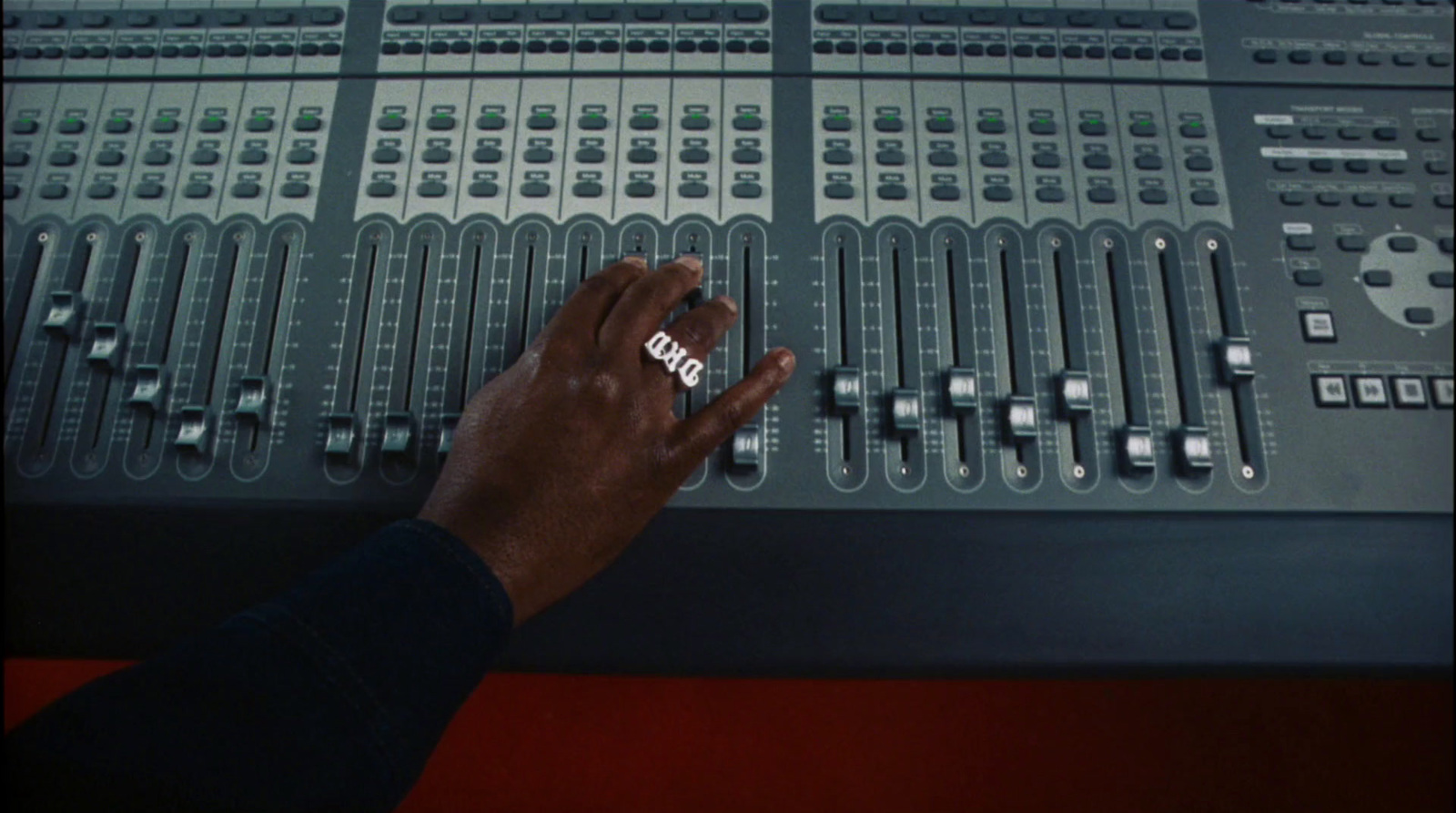 a person touching a sound board with their hand