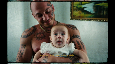 a man holding a baby in his arms