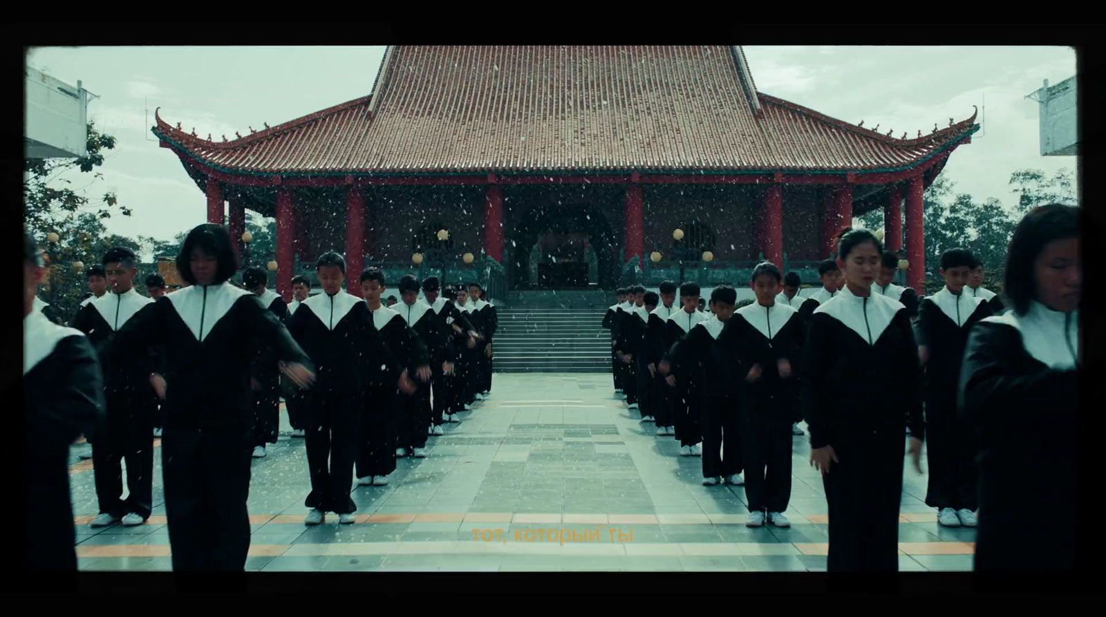 a group of people standing in front of a building