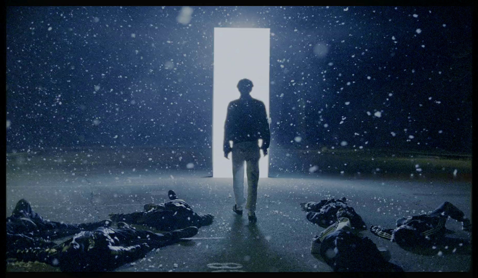 a man standing in front of a doorway in the snow