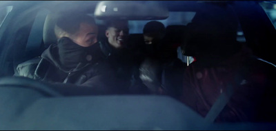 a group of people sitting in the back of a car