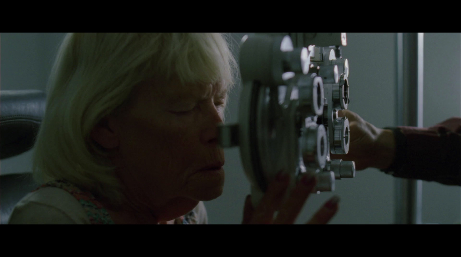 a woman looking at a clock in a room