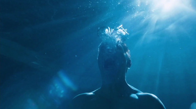 a man standing under water with his head under the water