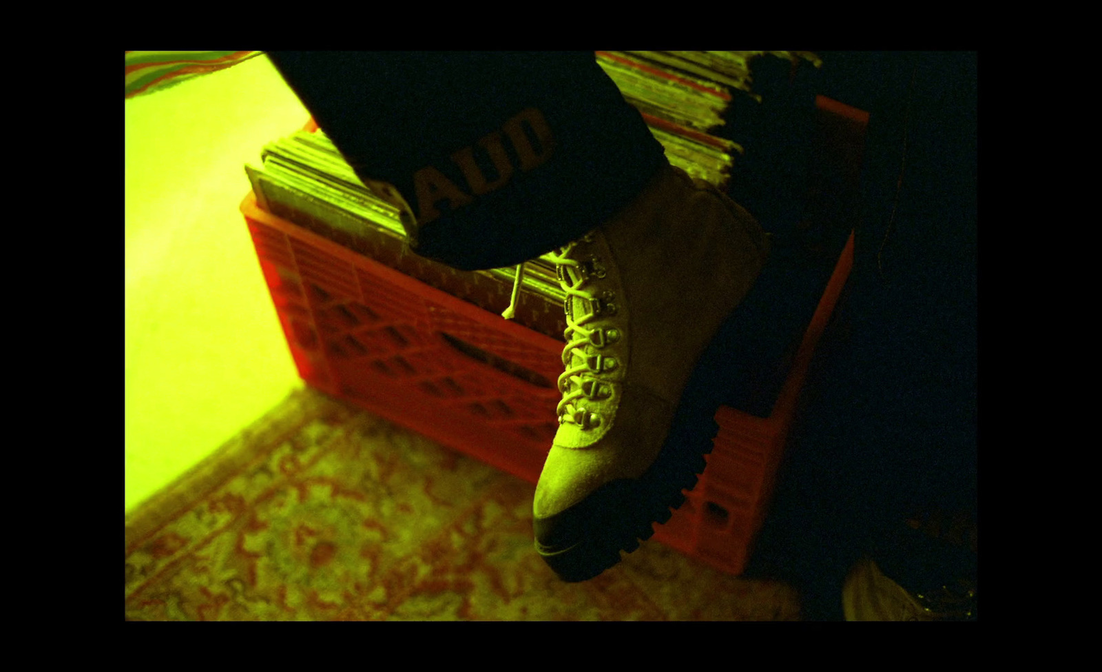 a person standing on top of a red crate